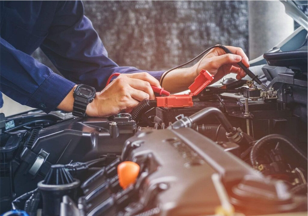 auto electrician repairing car battery in Auckland